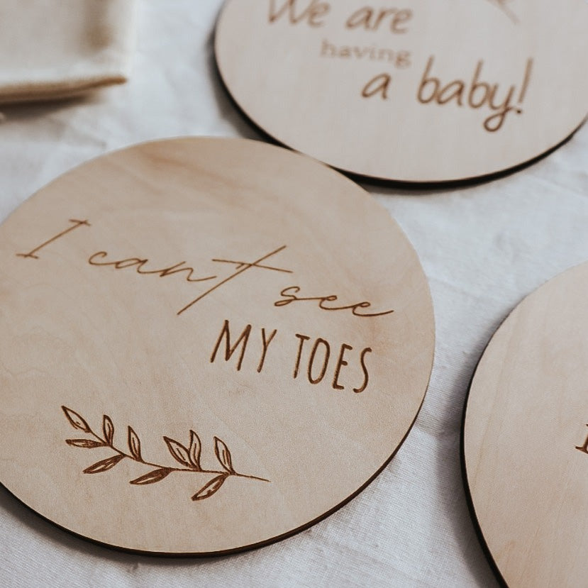 wooden milestone discs. pregnancy milestones. engraved. its a boy, girl, baby coming soon, hospital bag packed, your nursery is ready, we cant wait to meet you, i cant see my toes, we are having a baby.
