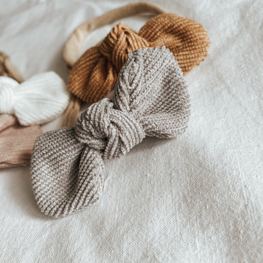 corduroy bow headband for baby girls. baby bows all sizes. adjustable. neutral colours and baby fashion accessories.