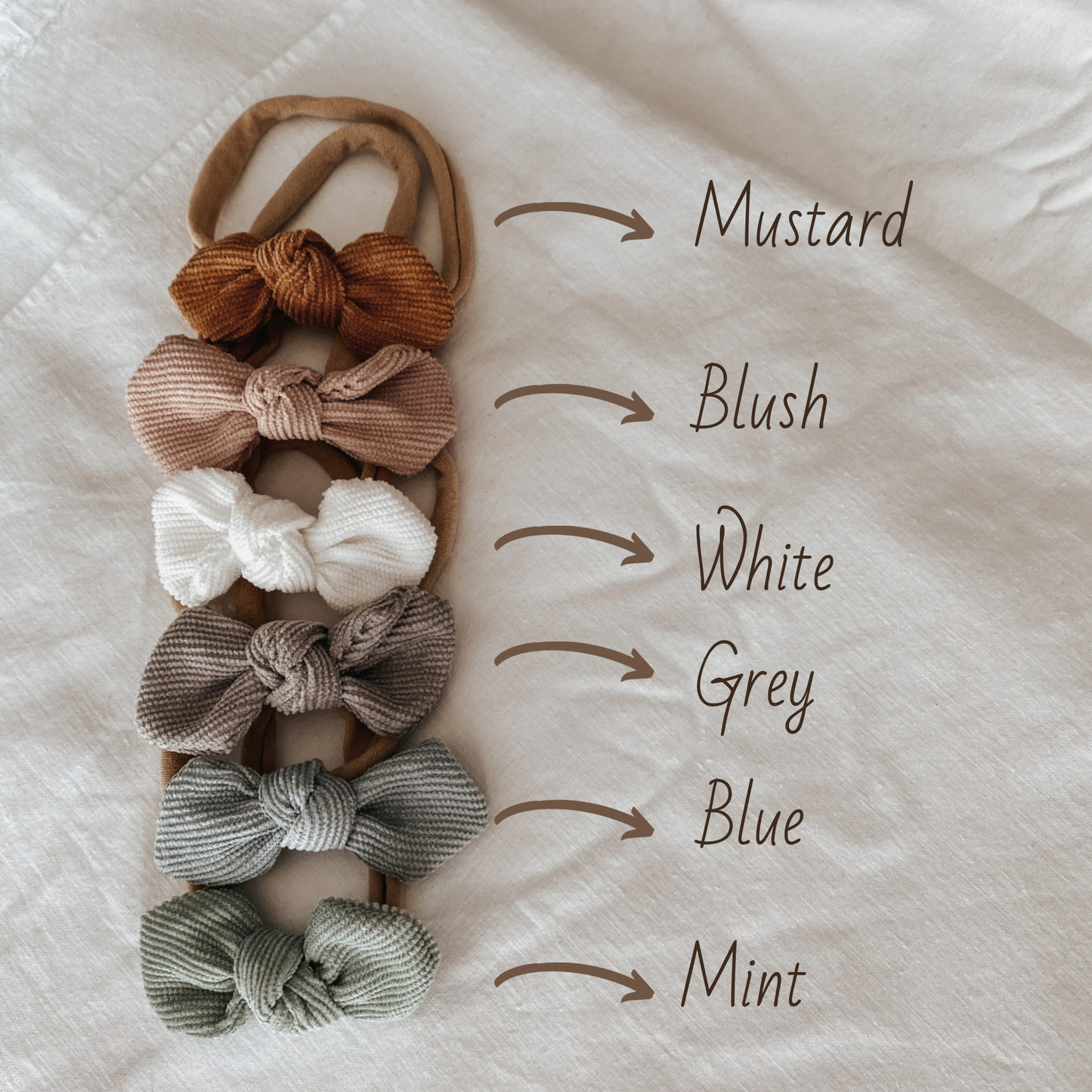corduroy bow headband for baby girls. baby bows all sizes. adjustable. neutral colours and baby fashion accessories.